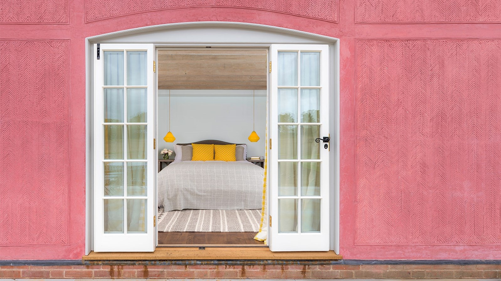 The pink theme runs throughout, with splashes of yellow in the bedrooms