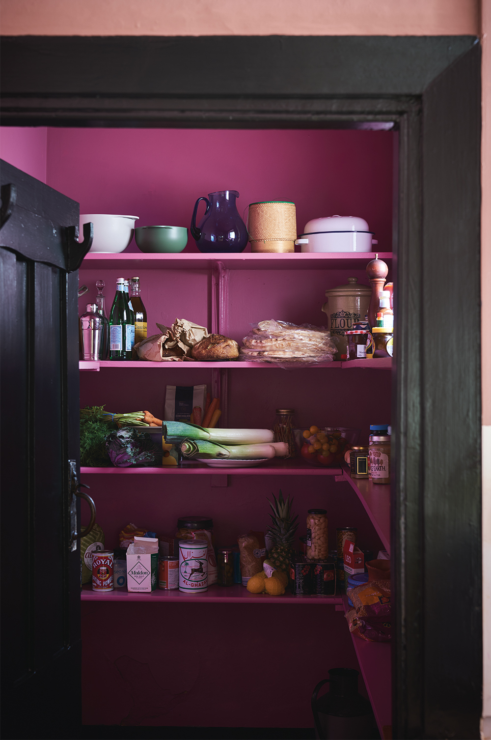 Charlotte suggests painting the inside of a bookcase or cupboard a bold pink hue for a hit of colour that isn’t too in-your-face
